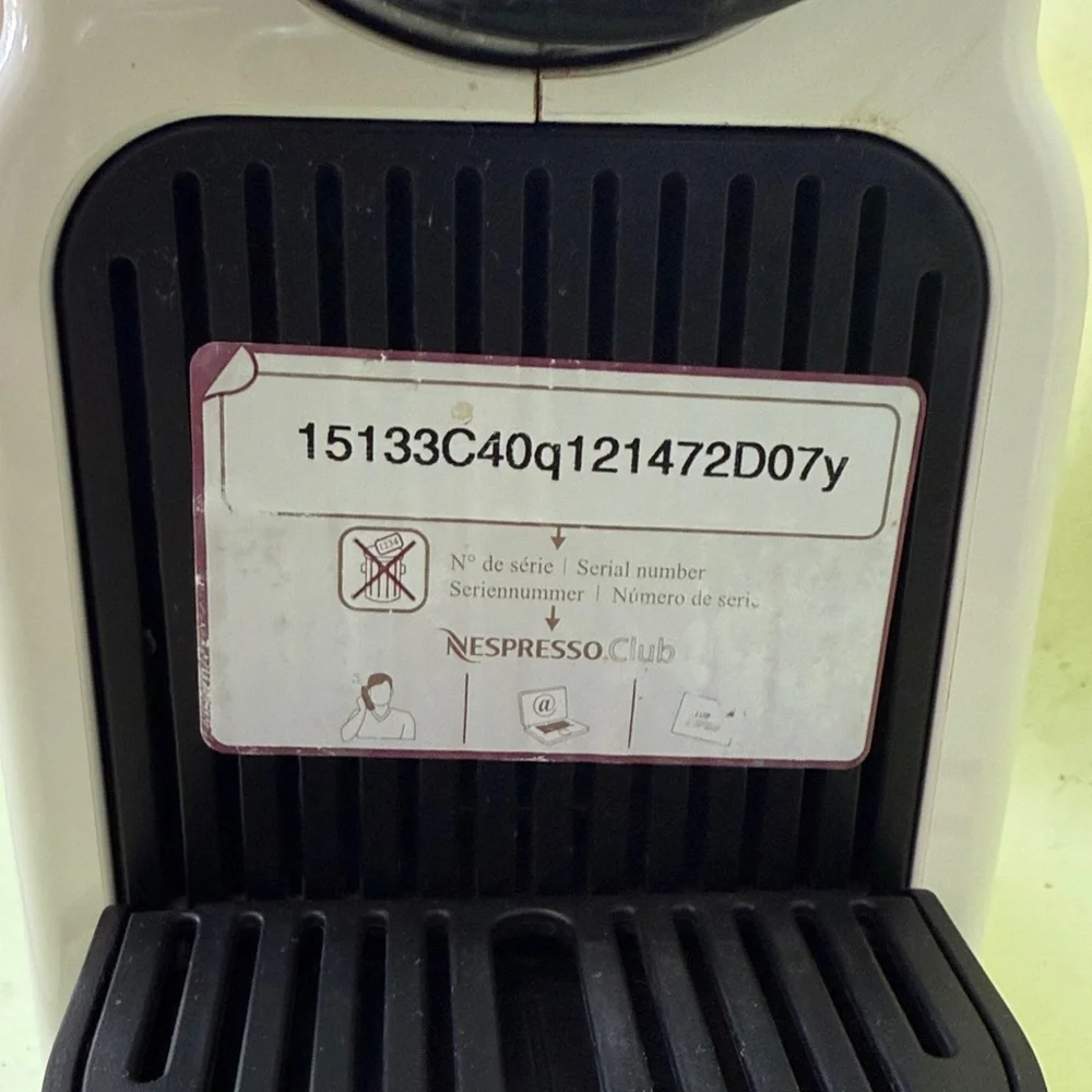 Nespresso White and Black Coffee Maker